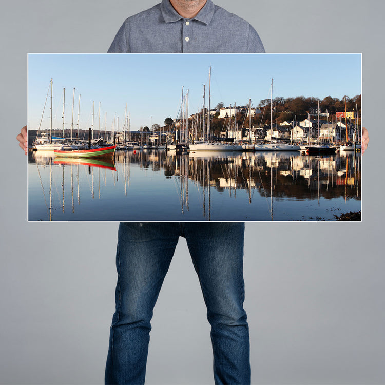 A man holds up a 100x50m panoramic canvas print 
