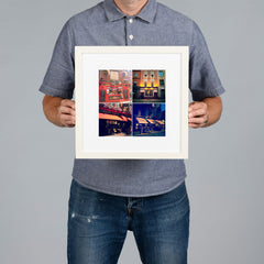 A man holds a white-framed photo print with a white mat. The print features a 2x2 collage photo grid of famous Dublin pubs. The print is 20x20cm and the frame is 34x34cm.  